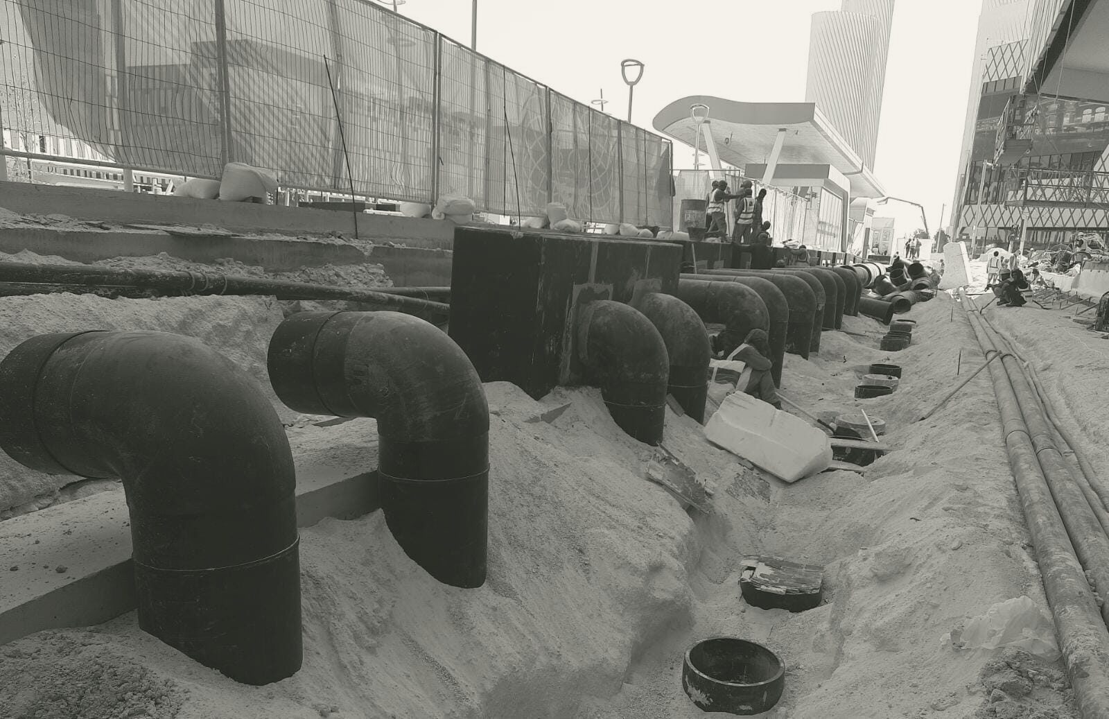 A run of insulated risers waiting for the paving