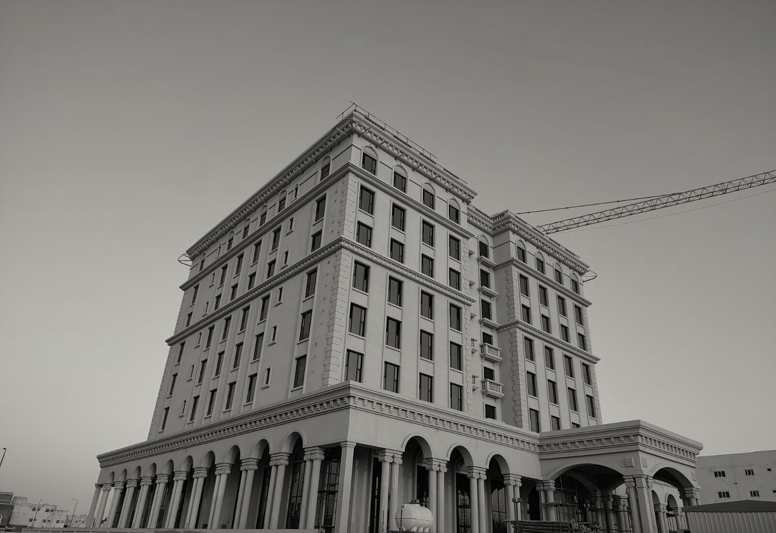 The Hilton Garden Inn, Al Hofuf, at golden hour, the tower crane above the roof