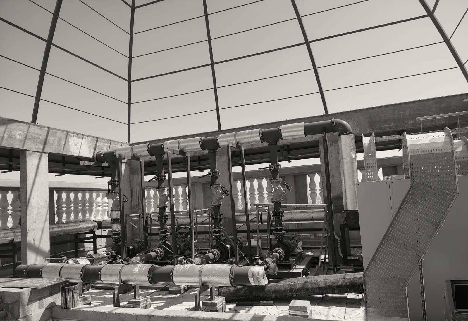 Chilled-water pump sets on the roof of the Hilton Garden Inn, Al Hofuf, under the dome frame