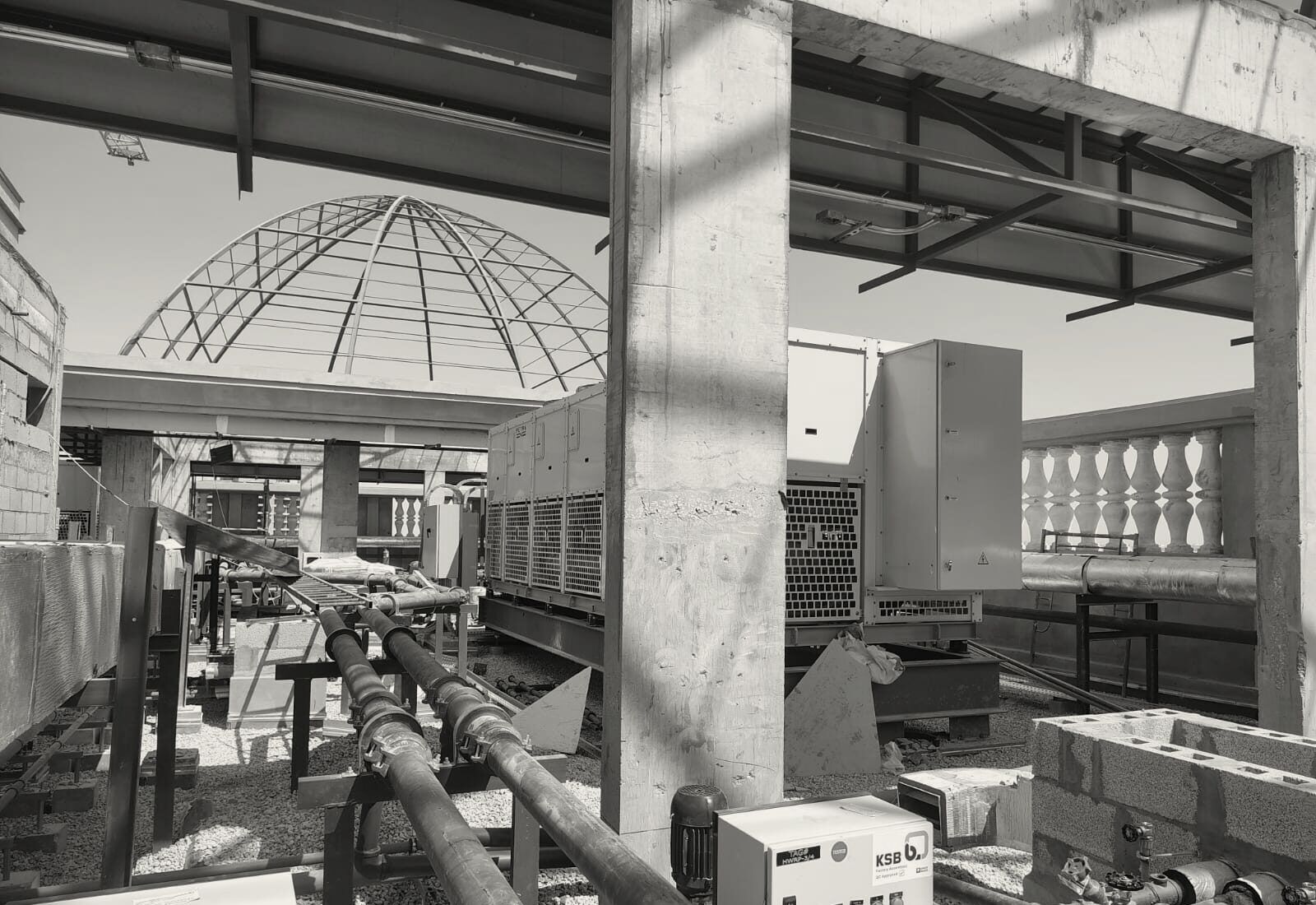 The dome frame rising over the roof plant