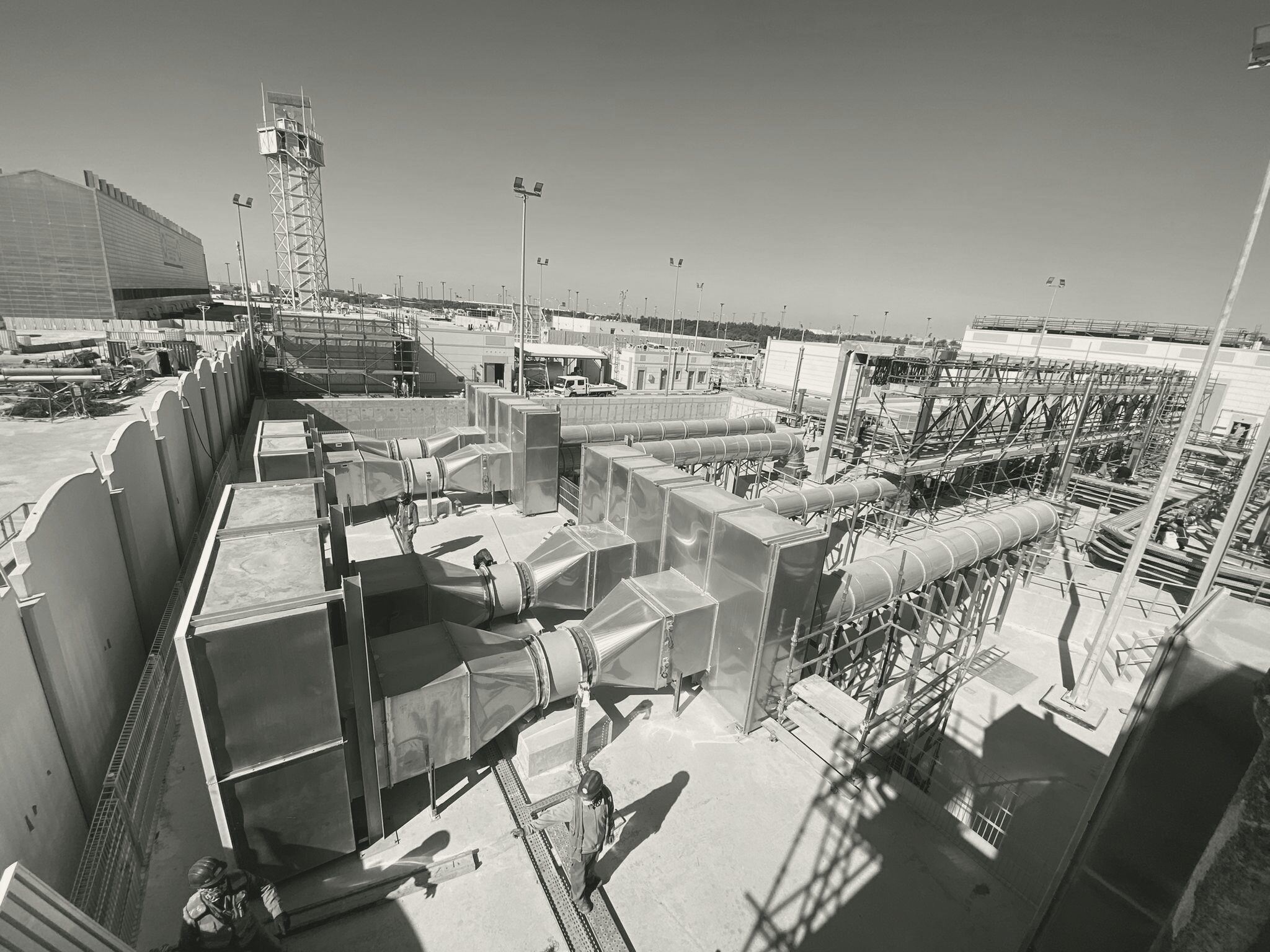 Crews on the pumping station roof beside the exhaust ductwork