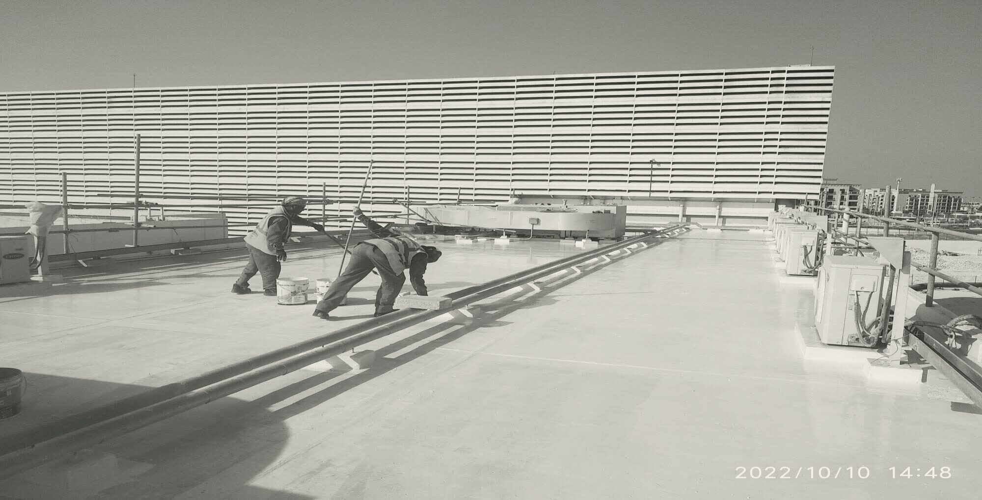 Crews beside the cooling tower louvres